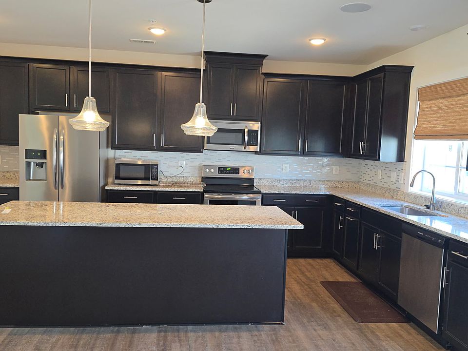 Modern large kitchen with quartz counter tops