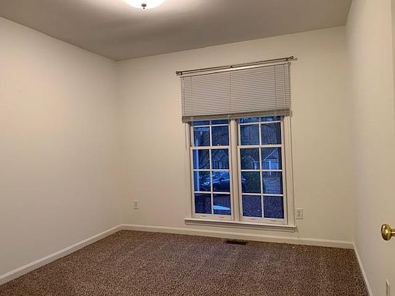 One of two identical spare bedrooms