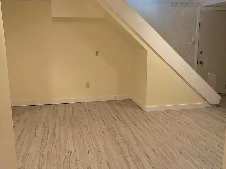 Fully-finished basement includes a separate laundry room with lots of storage and the door to the attached garage. And the piano.