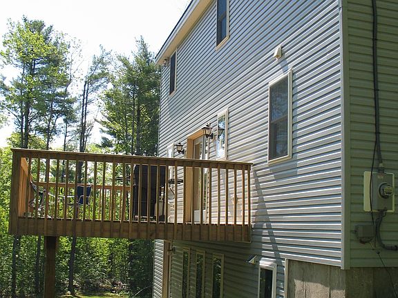 Rear of home with deck