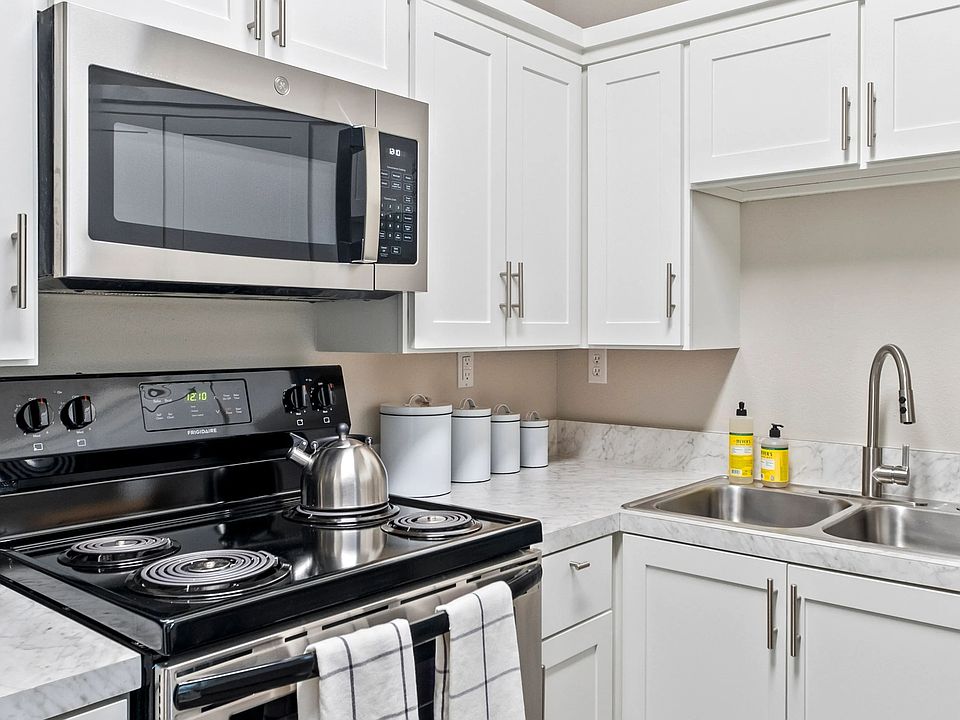 This brilliantly upgraded kitchen will serenade your senses. Capture the luminous allure as it dances off the white cabinets and glistening stainless-steel appliances.