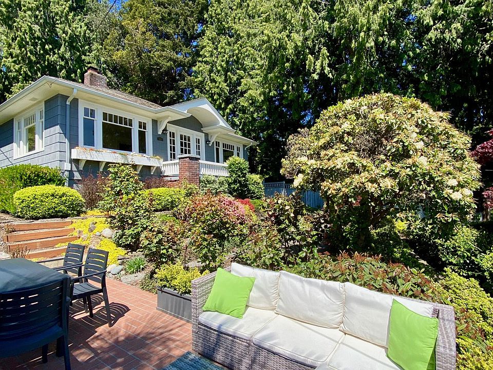 Front of house with seating patio area