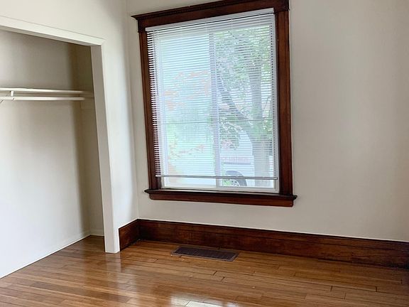 Large master bedroom with refinished hardwood floors