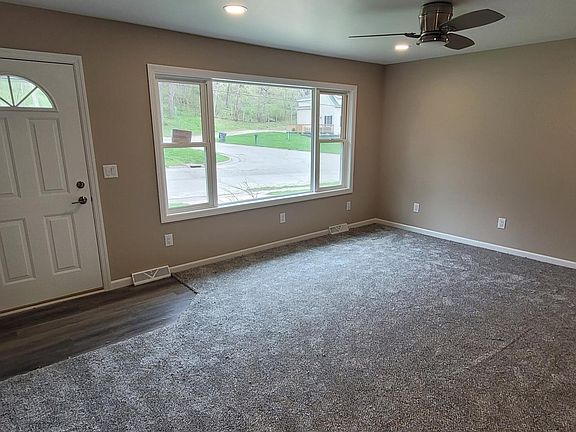 Front entrance and family room with new carpet