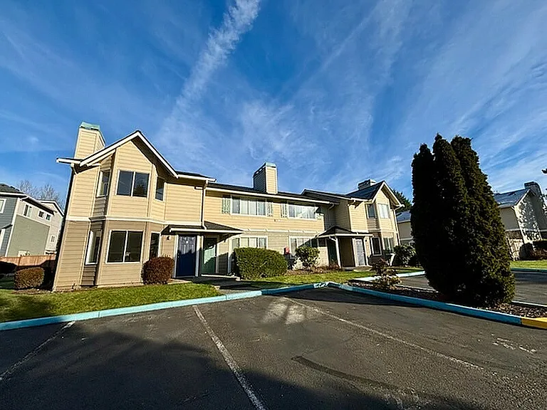 Experience modern living in these charming two-story apartments, featuring scenic views and lush surroundings.