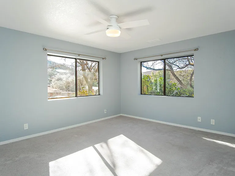 3rd bedroom with windows to the front of the house. Walk in closet.