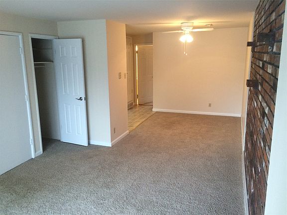 Living room with view of coat closet
