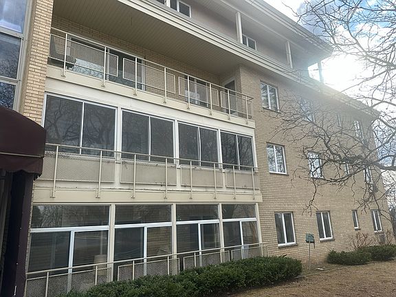 Outside of building - 2nd floor screened in porch/patio.