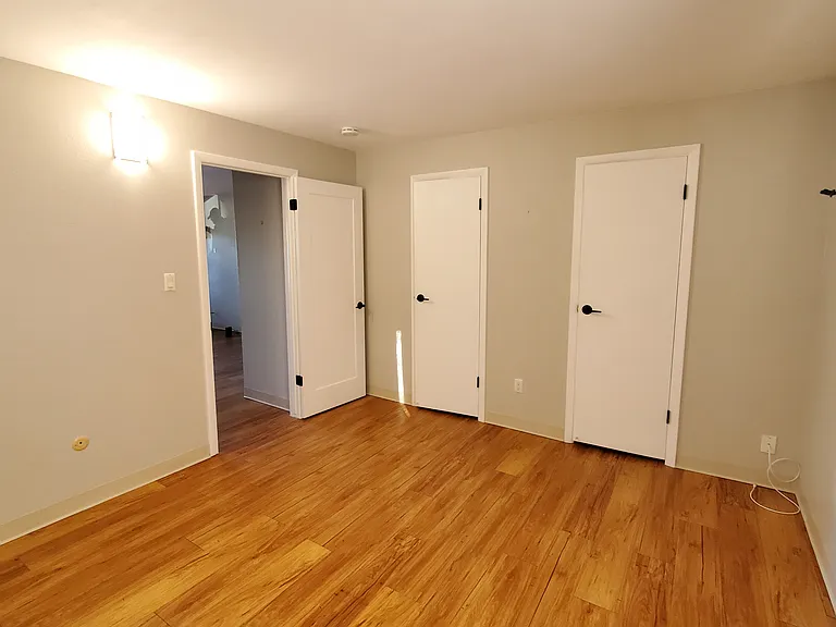 Bedroom with two closet door access