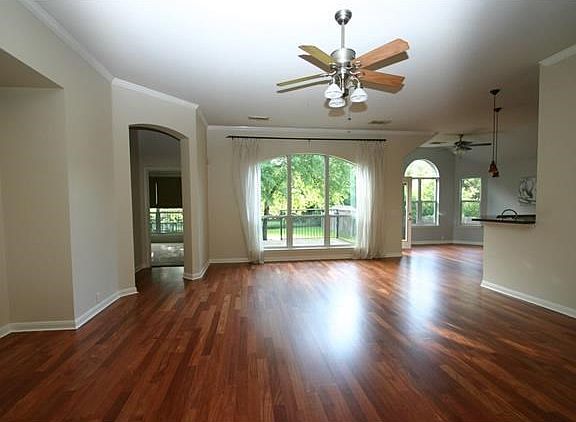 View of the family room from the foyer.Stunning Brazilian hardwood flooring.
