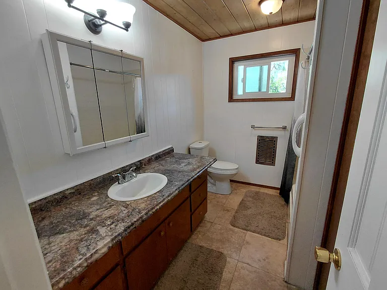 Full bathroom with tub and shower.