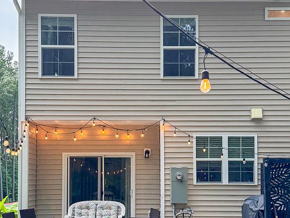 Back yard with extended Patio, privacy wall and string lights