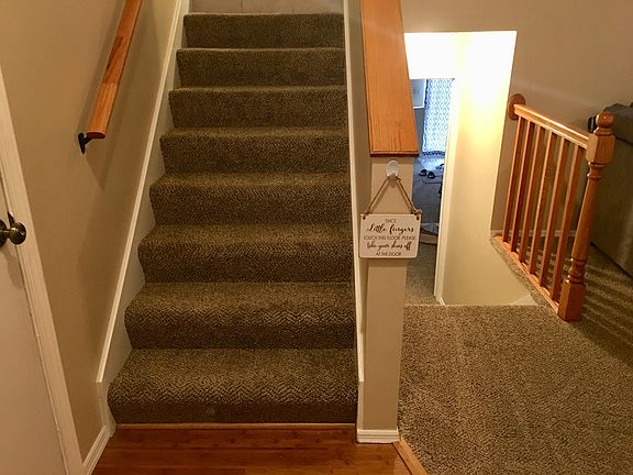 Stairs going up to kitchen