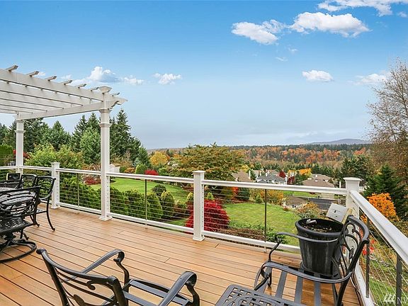 Outdoor patio and pergola with views of the Seattle skyline and mountains
