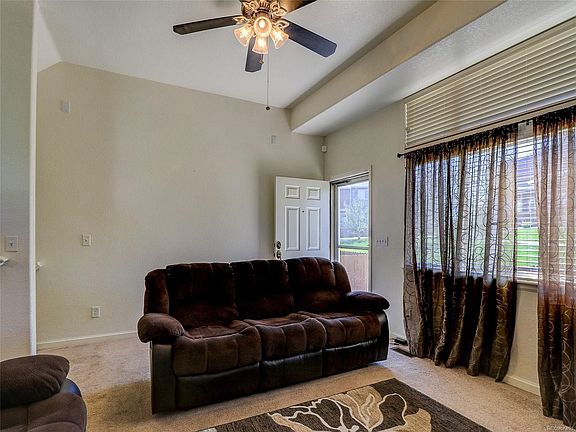 FAMILY ROOM- FEATURING GAS FIREPLACE, CEILING FAN, AND SPEAKER PRE-WIRES.