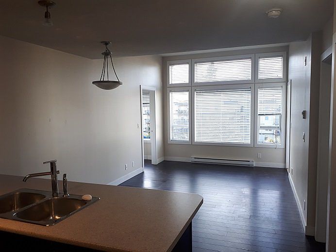 The living room with one huge window (only on top floor available).