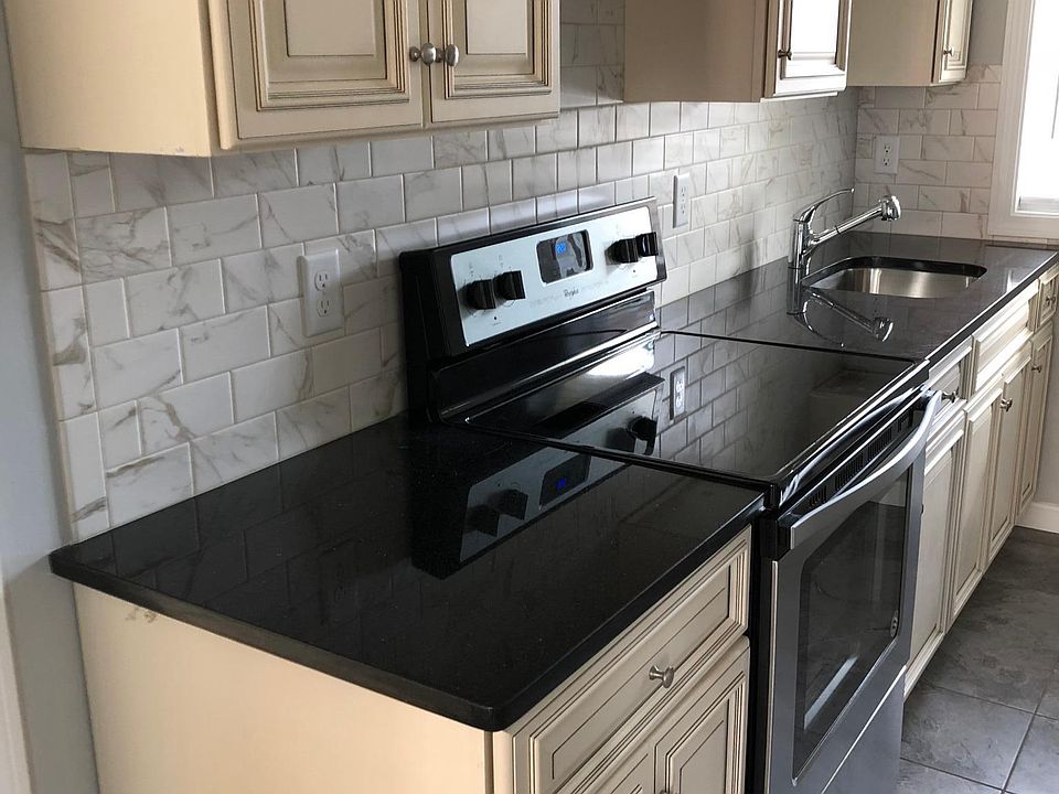 Stunning kitchen with marble backsplash, stainless appliance