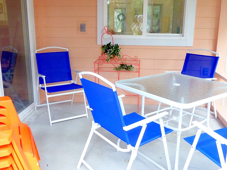 A kitchen window can be open to pass through your favorite snacks or meals to the back screened porch.