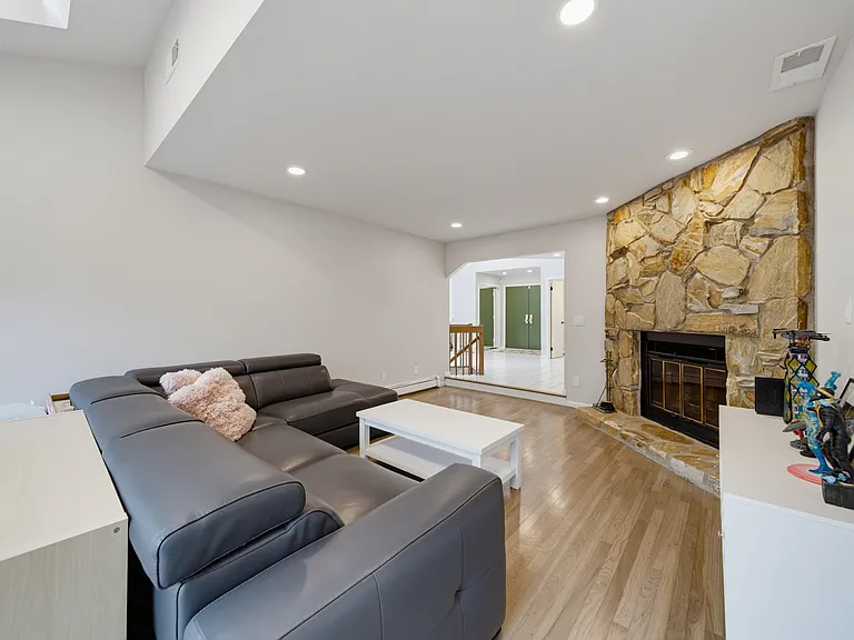 SUNKEN FAMILY ROOM WITH FIREPLACE