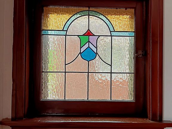 Two stain glass windows in front room