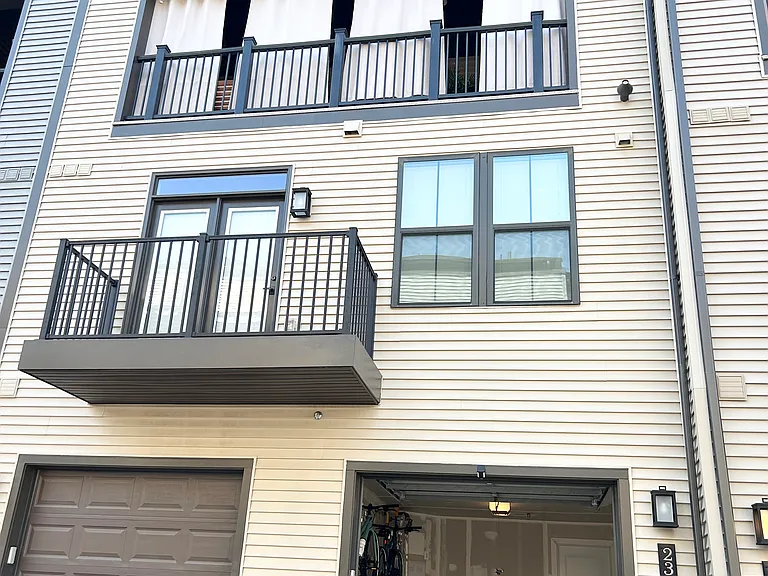 The smart-enabled security camera mounted above the garage exterior is great for securing the garage entryway or to simply check for delivered packages