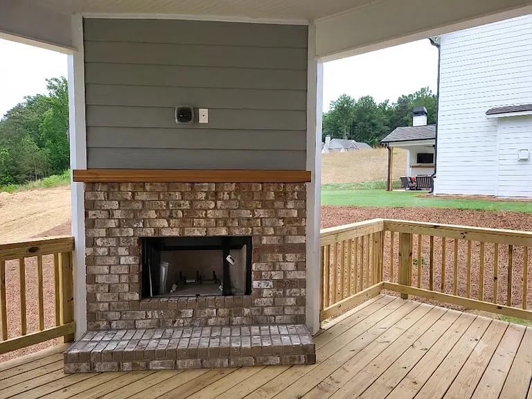 Fireplace on covered Deck, with ceiling fan, TV connections ready