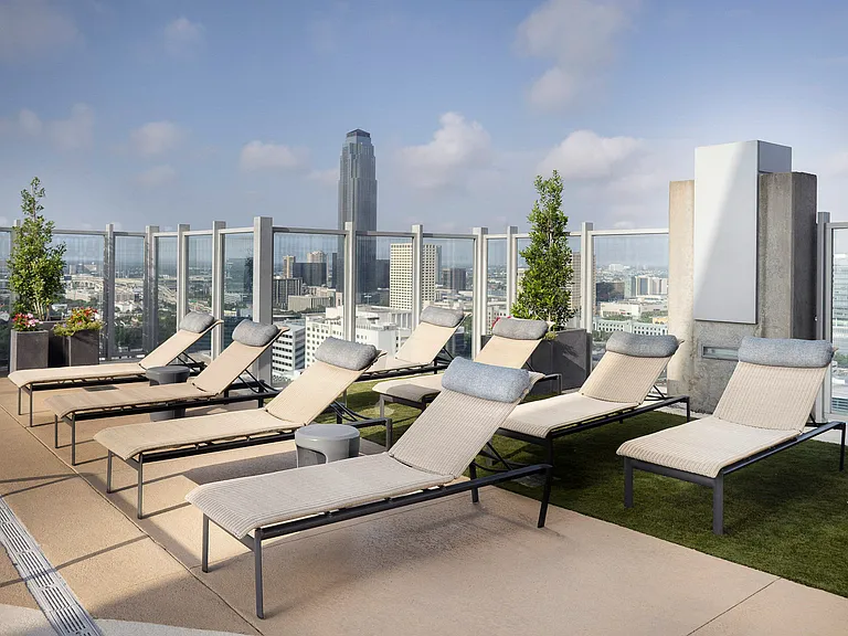 Pool deck lounge seating, BBQ grills and dining areas available
