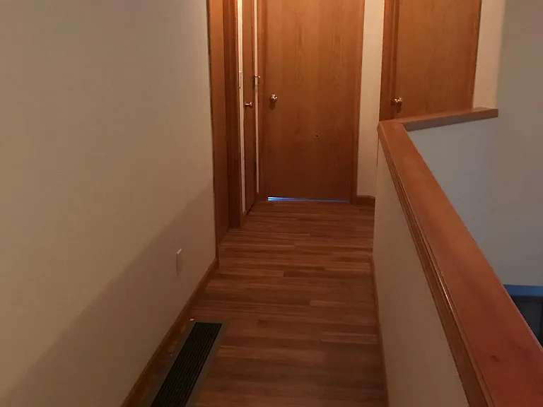 Upstairs walkway between bedrooms and full bathroom