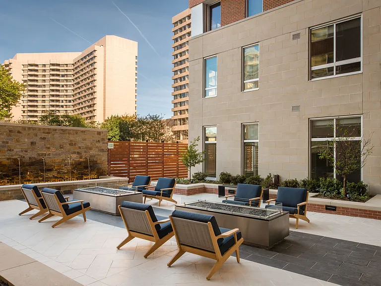 Courtyard with Outdoor Fireplaces, Landscaping, and Elegant Water Feature