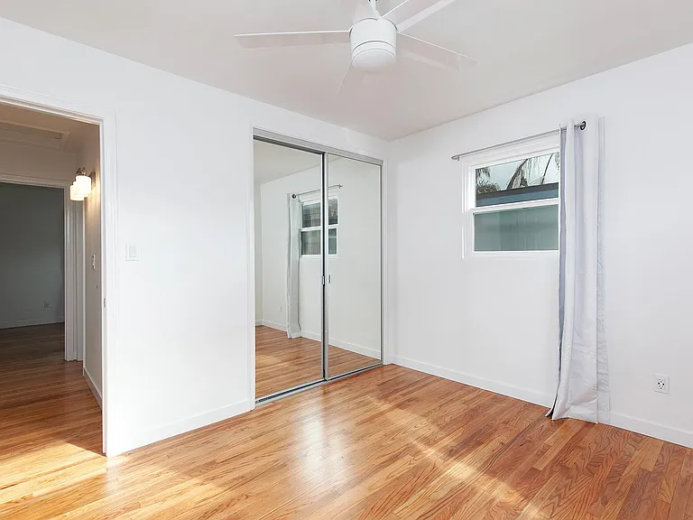 bedroom #2. Bathroom is off the connecting hallway by hallway lights that are on a dimmer. Entrance to living room is on left side of this hallway.