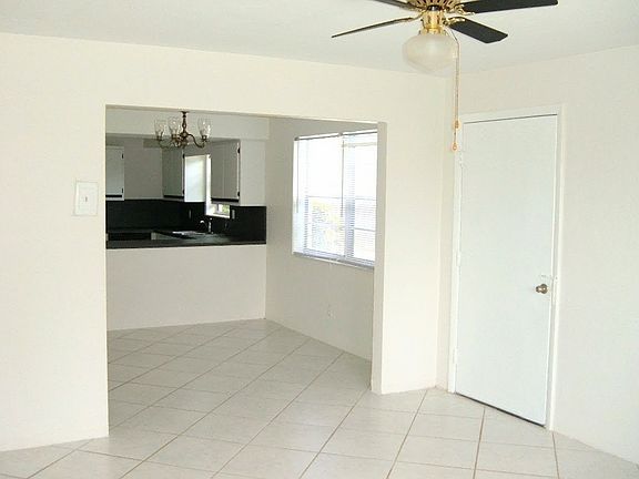 Entrance Door to Living Room, on right is Dining Room and Kitchen.