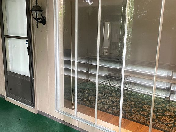 Front door and floor to ceiling window