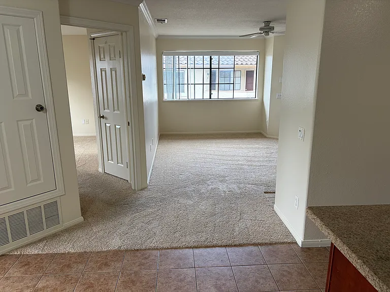 Living room and master bedroom as seen from the kitchen