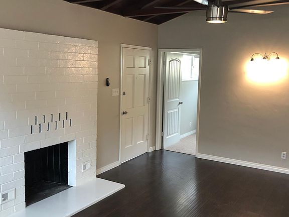 Family Room - exposed wood-beam ceiling and lots of windows 