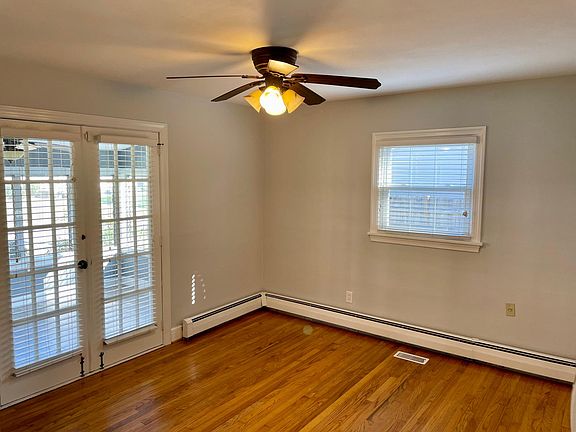 Master Bedroom with double doors walking out to the sunroom.