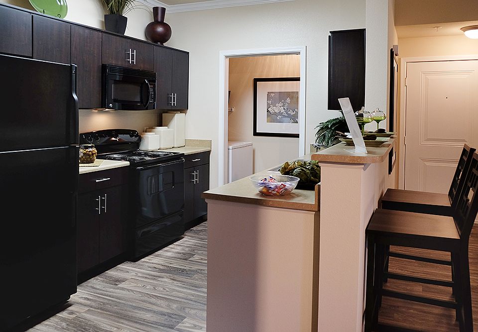 Black forest cabinets and black appliances give your kitchen