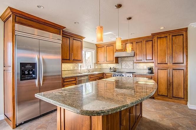 Kitchen with island and stainless steel appliances