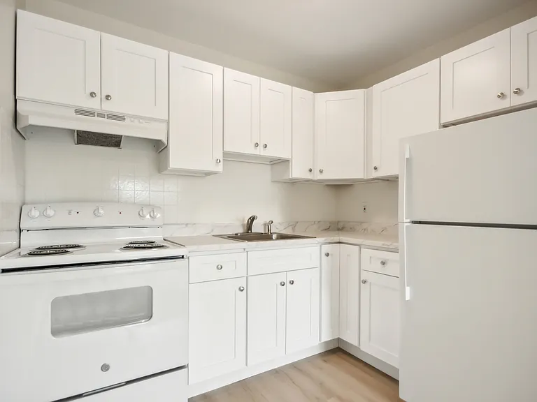 1-Bedroom Kitchen with Range & Refrigerator, lots of cabinet space.