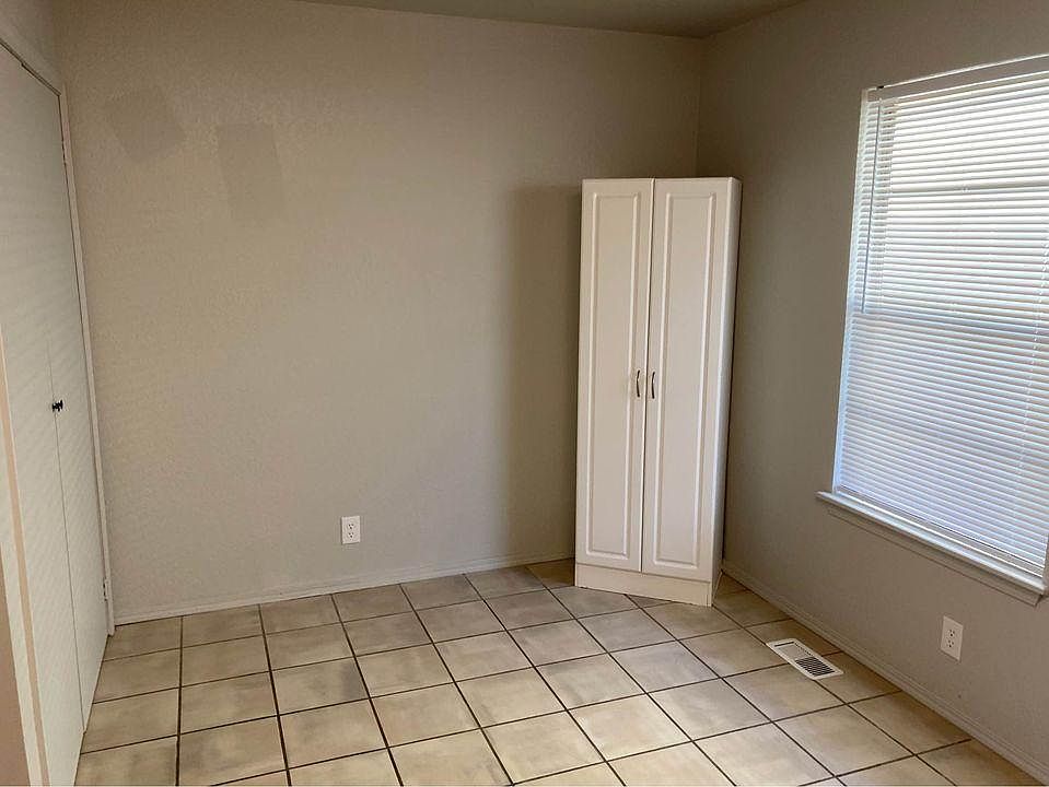 Kitchen table area with extra cabinet space.