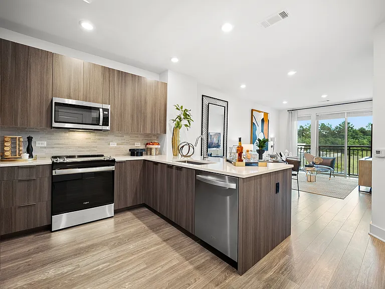Chef-inspired kitchen with premium appliances, a spacious island and premium granite countertops with open-concept floor plan