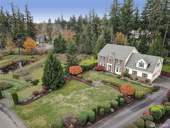 Here you see the front half of the yard with the neighboring retention pond beyond.