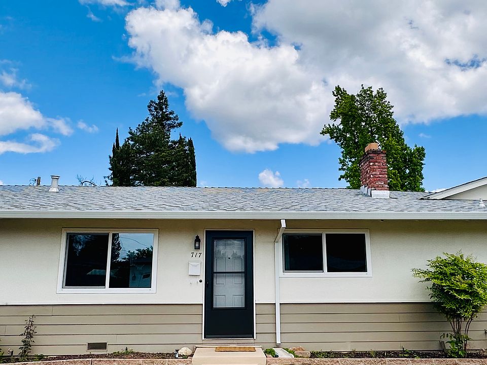 Front door, plenty of parking on the street, and a carport