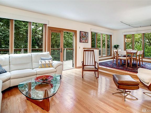 Living and dining rooms both have beautiful hardwood floors and Andersen windows. 