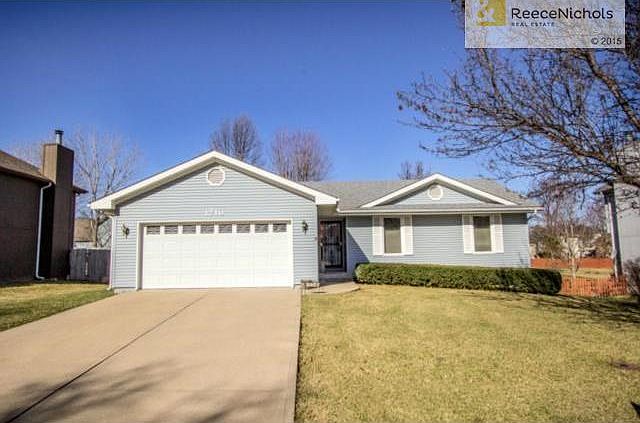 TRUE RANCH HOME WITH TREED LEVEL FENCED YARD.
