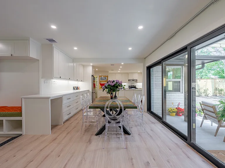 Spacious dining area connecting seamlessly to the kitchen and living room, perfect for hosting gatherings.
