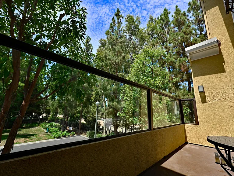 Balcony with park view with no one in the front to overlook the biking trails