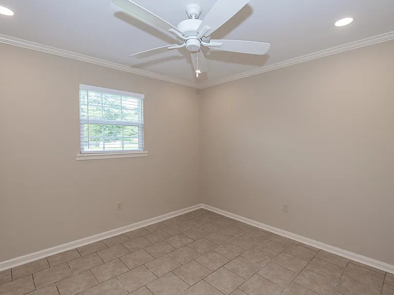 Another view of larger bedroom.