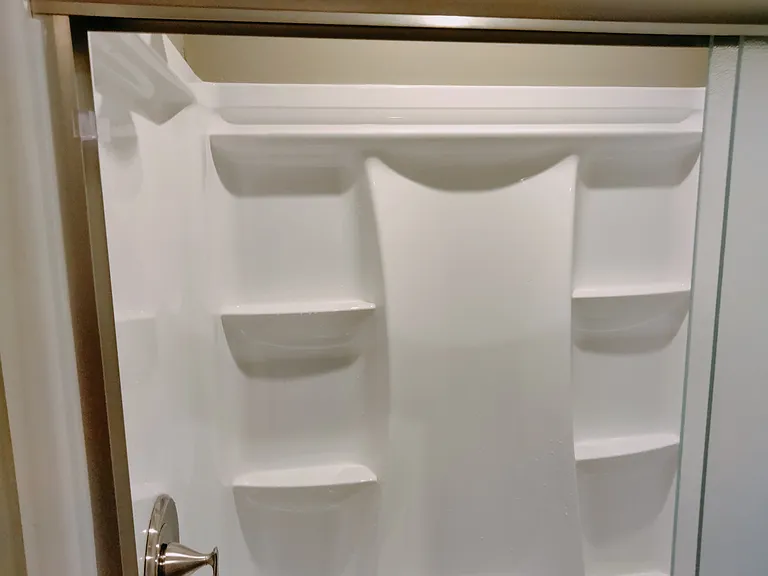 upstairs shower w shelves, new