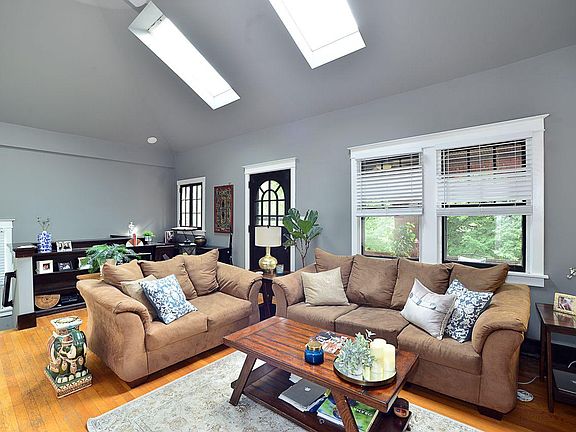Living Room with skylights and entrance to covered balcony