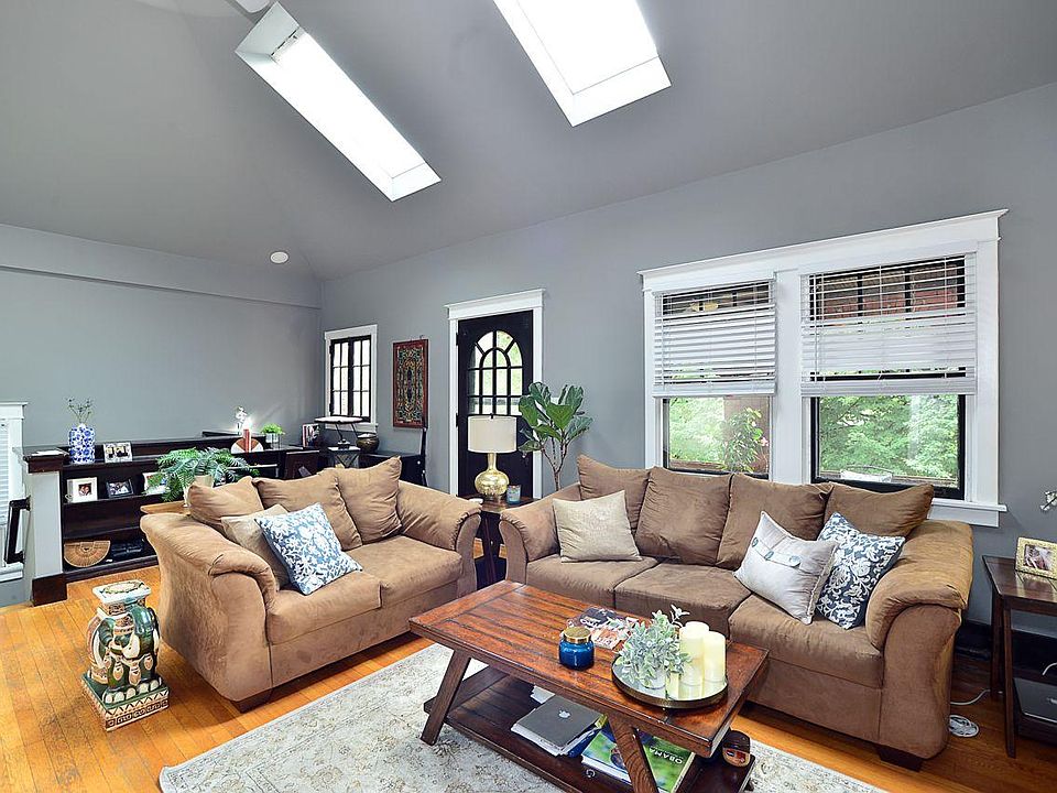 Living Room with skylights and entrance to covered balcony